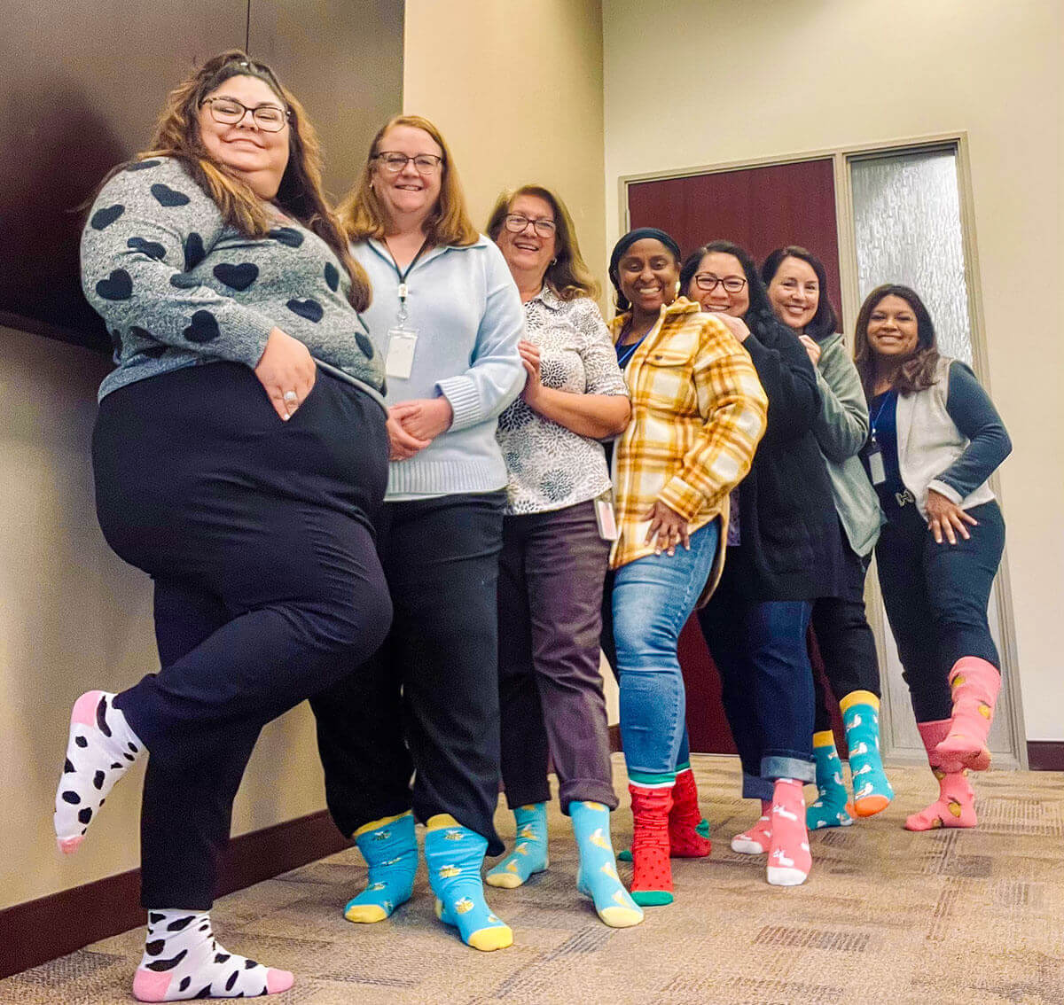 The fun and friendly Early Start staff shows off their favorite socks